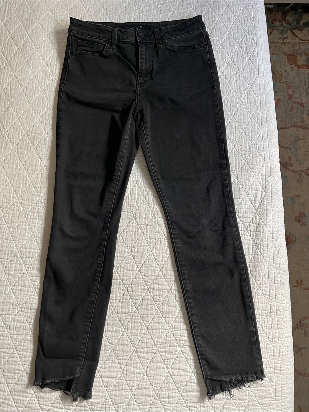 Joe’s black skinny jeans with ripped edges